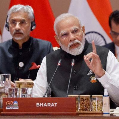 India's Prime Minister Narendra Modi (C) has used the G20 presidency to burnish his image at home and abroad