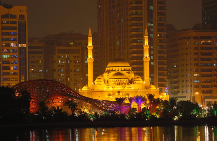 An Al Noor Mosque Surrounded with City Buildings at Night 