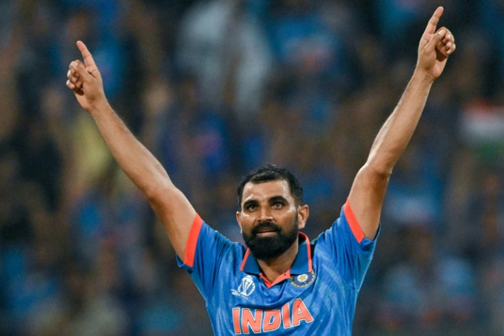 Key strike: India's Mohammed Shami celebrates his dismissal of New Zealand captain Kane Williamson