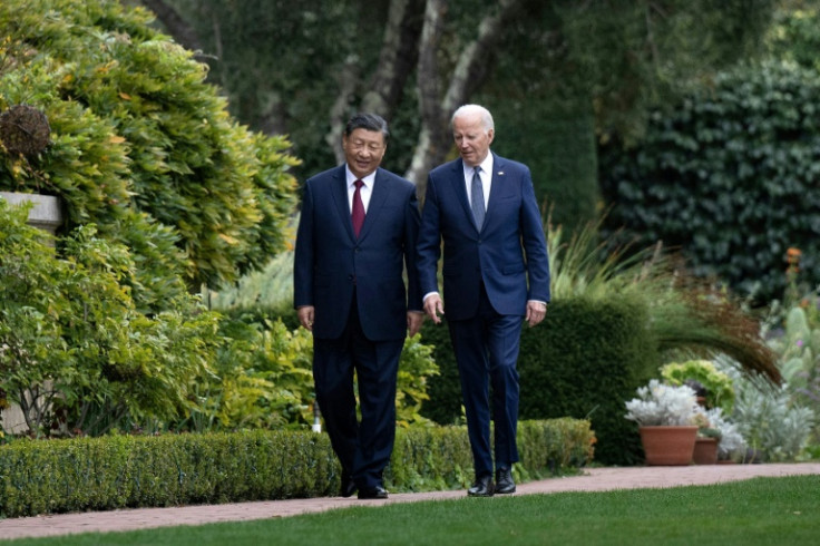 US President Joe Biden and Chinese President Xi Jinping walk together after a meeting in Woodside, California on November 15, 2023