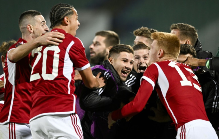 Hungary players celebrate after clinching qualification for the 2024 European Championship