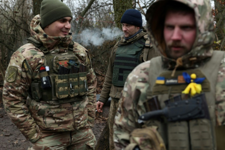 Ukrainian servicemen take a break on the frontline near the town of Bakhmut, Donetsk region