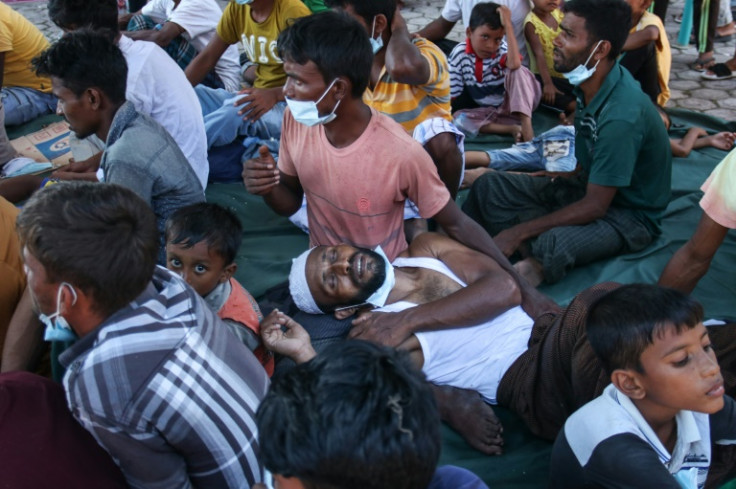 Newly arrived Rohingya refugees rest at a local prayer hall in Indonesia's Kulee, Aceh province