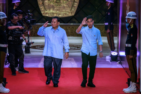Presidential candidate and Indonesia's Defence Minister Prabowo Subianto (L) has opened up a wide lead over his rivals after choosing Gibran Rakabuming Raka (R) as his running mate