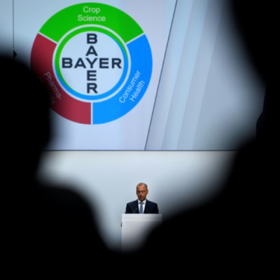 The logo of German chemicals giant Bayer, which owns Monsanto, seen at its general meeting in Bonn, Germany in 2019