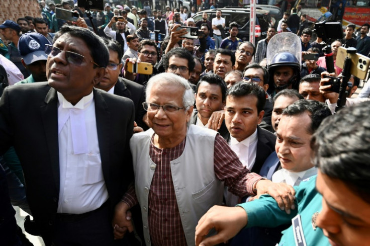 Bangladeshi Nobel peace laureate Muhammad Yunus (C) appears in a court in Dhaka on January 1, 2024. Yunus was facing six months in jail with a court set to rule on January 1 on a labour law case decried by his supporters as politically motivated.