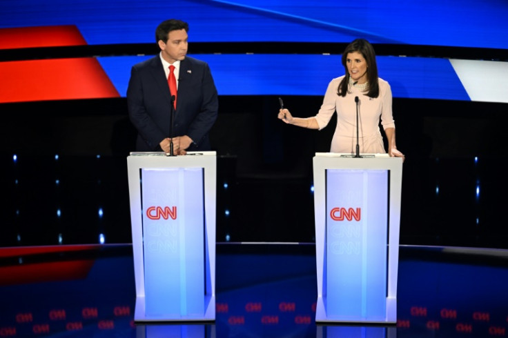 Ron DeSantis (L) and Nikki Haley speak during the fifth Republican presidential primary debate at Drake University in Des Moines, Iowa, on January 10, 2024