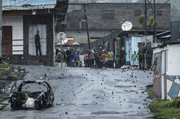 Opposition supporters throw stones at security forces, build street barricades and have burned official buildings