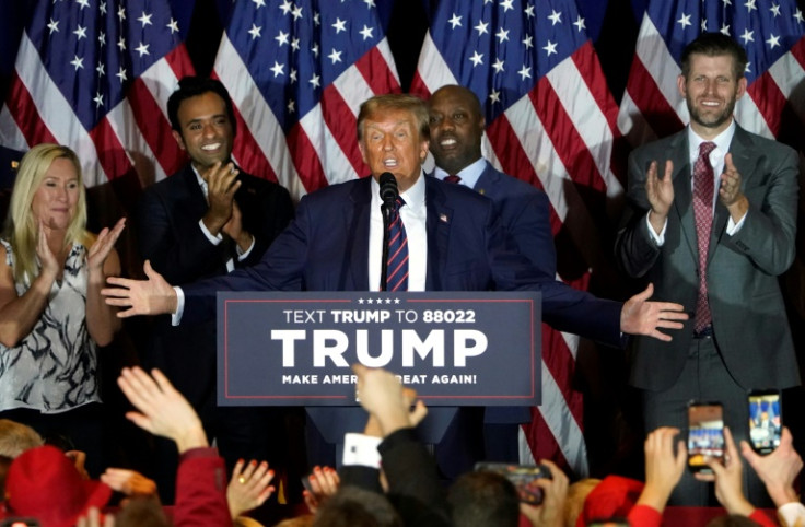 Republican presidential hopeful Donald Trump gestures to his supporters after winning the New Hampshire primary