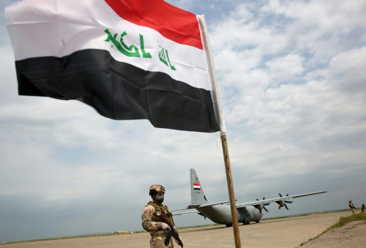 An Iraqi soldier walks at the Qayyarah air base, where US-led troops in 2017 had helped Iraqis plan out the fight against the Islamic State in nearby Mosul in northern Iraq, before a planned US pullout on March 26, 2020