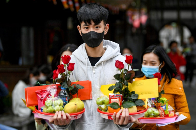 Young Vietnamese flock to an ancient pagoda in Hanoi hoping a Valentine's Day offering will help them find a partner