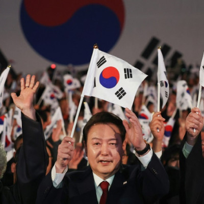 South Korean President Yoon Suk Yeol (C) called for the international community to back 'unification efforts' with the nuclear-armed North