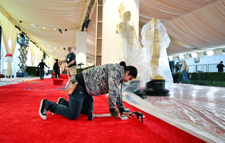 Preparations continue on the red carpet for the Oscars, which the stars of 'Barbie' are expected to turn a bright shade of pink