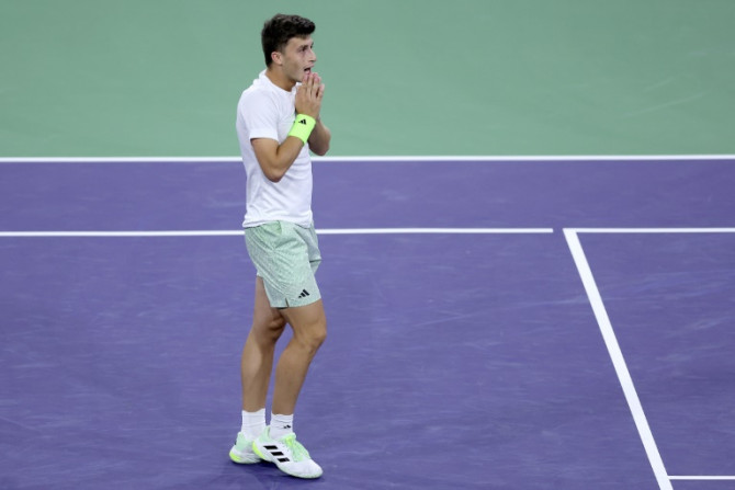 Italy's Luca Nardi celebrates his stunning upset of world number one Novak Djokovic