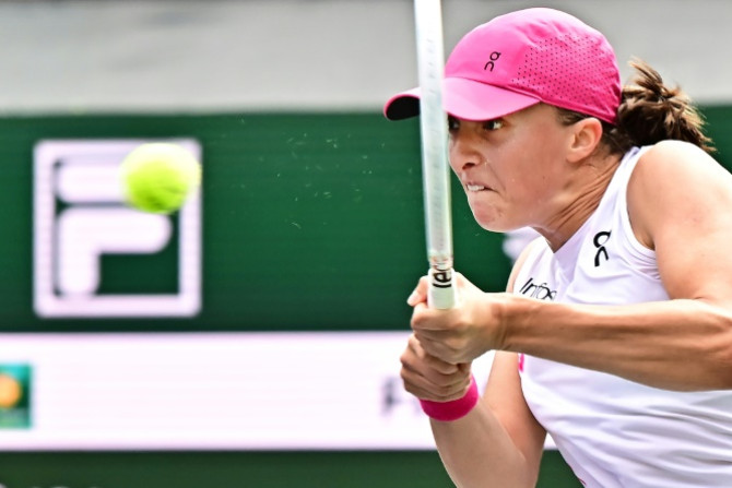 World number one Iga Swiatek hits a backhand on the way to victory over Greece's Maria Sakkari in the women's final of the ATP-WTA Indian Wells Masters