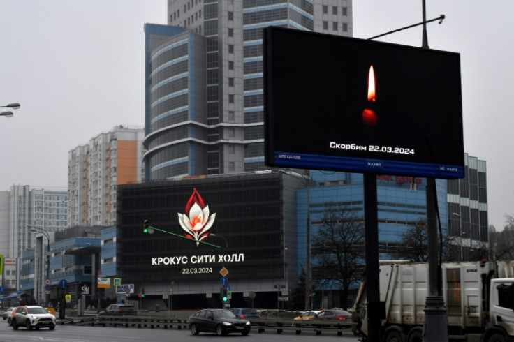 Russia observed a day of national mourning on Sunday, as dozens came to lay flowers at a memorial to the victims