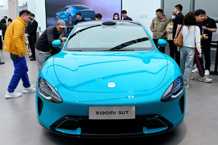 A Xiaomi SU7 electric car is displayed at a Xiaomi store in Beijing on March 26, 2024.