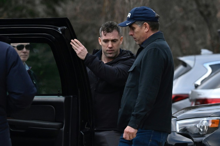 Hunter Biden walks back to the motorcade after visiting a jewelry store with his father US President Joe Biden in Greenville, Delaware, on December 18, 2023.