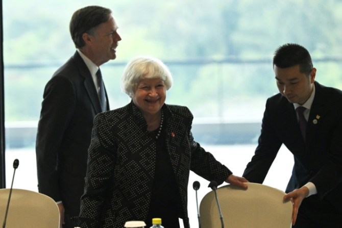 US Treasury chief Janet Yellen (C) and Ambassador to China Nicholas Burns (L) attend a roundtable with business leaders in Guangzhou