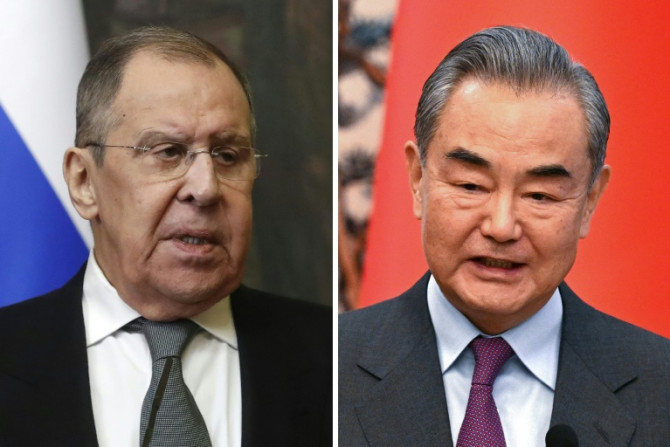 China's top diplomat said Beijing would strengthen strategic cooperation with Moscow, Russian state media reported, as he met his counterpart for talks