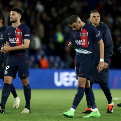 Kylian Mbappe walks off the pitch with PSG teammates after the French side's 3-2 defeat by Barcelona in the first leg of their Champions League quarter-final tie