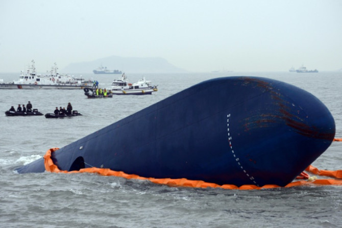 File photo from April 17, 2014 shows the coast guard searching for passengers near the Sewol ferry that capsized on its way to Jeju island killing hundreds of schoolchildren