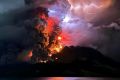 The crater of Mount Ruang flamed with lava against a backdrop of lightning bolts overnight after erupting five times