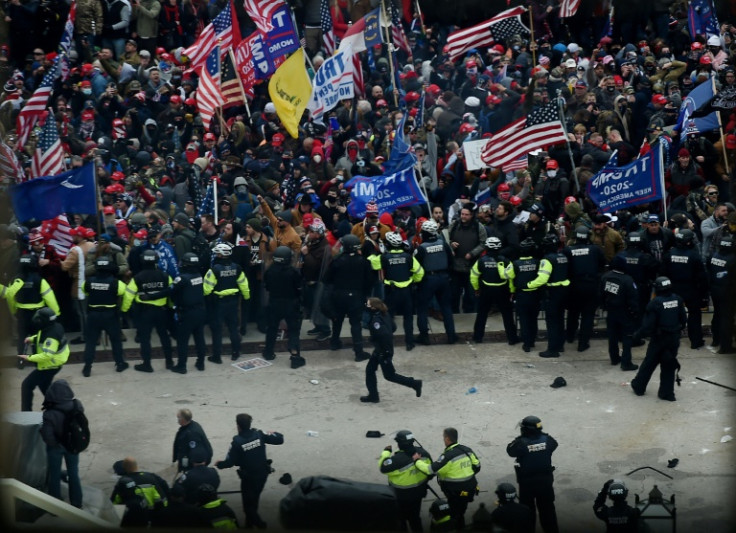 Police hold back supporters of US president Donald Trump outside the US Capitol on January 6, 2021