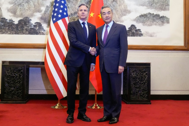 Chinese Foreign Minister Wang Yi (R) receives US Secretary of State Antony Blinken at the Diaoyutai state guesthouse