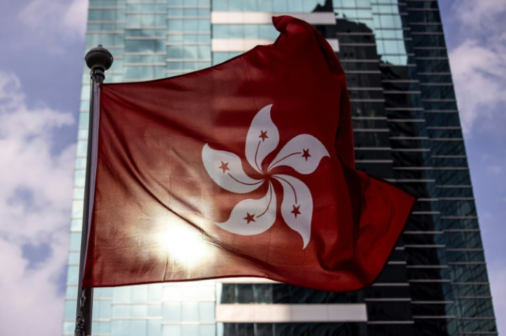 The Hong Kong government said it had cancelled the passports of six democracy activists who fled to the United Kingdom