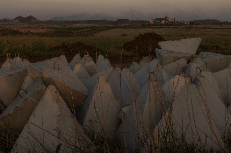 Ukrainian defensive lines with smoke rising over the horizon outside Toretsk