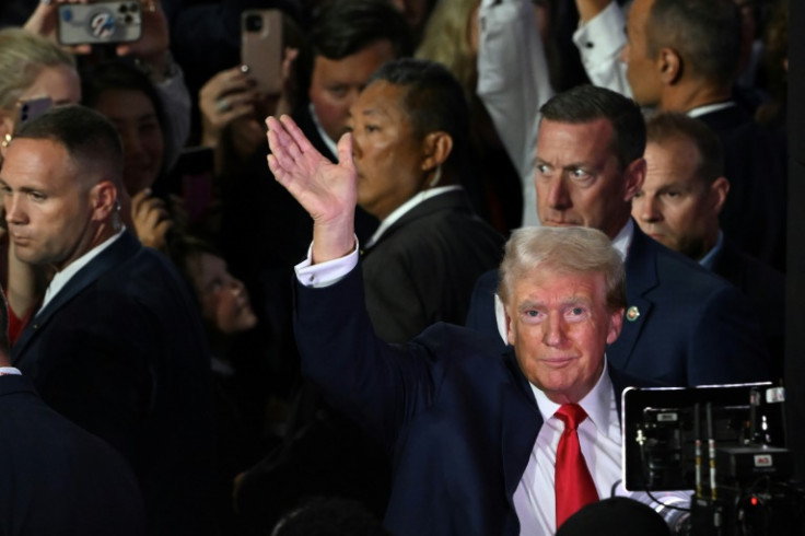 All-male Secret Service agents can be seen surrounding Trump as he enters the Republican National Convention days after the shooting