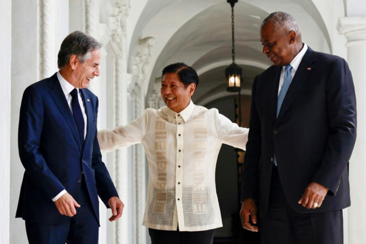 Philippine President Ferdinand Marcos (C) welcomes US Secretary of State Antony Blinken (L) and Defense Secretary Lloyd Austin