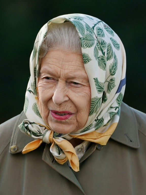 The sculpture depicts the queen in a headscarf and country dress