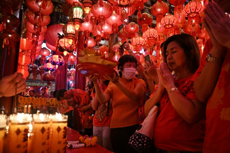 Millions of Thai-Chinese marked Lunar New Year with parties, family meals and visits to many of the shrines dotted around Chinatown