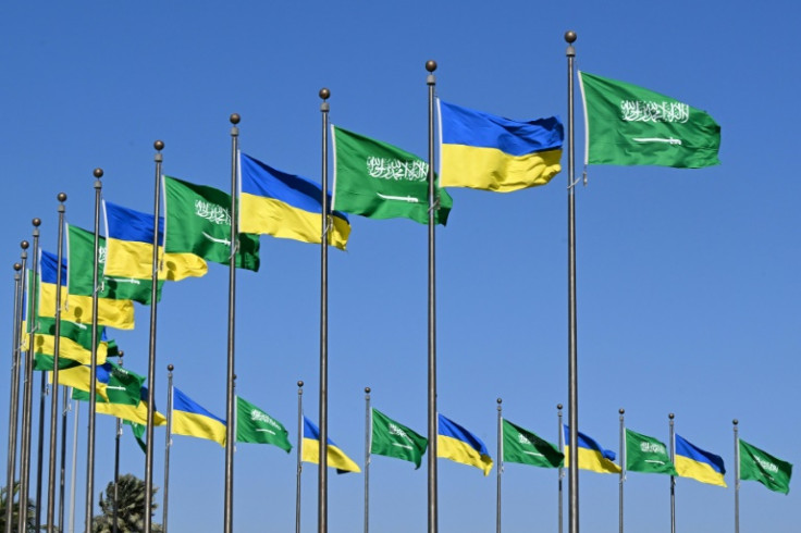 Flags of Saudi Arabia and Ukraine line a road in Jeddah before a visit by Ukainian President Volodymyr Zelensky