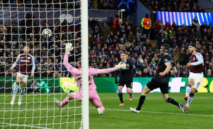 Marco Asensio (R) scores one of his two goals in Aston Villa's 3-0 win over Club Brugge