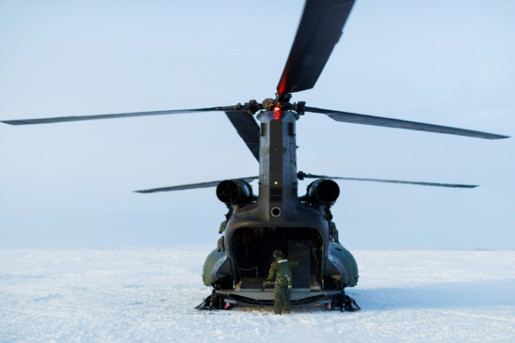 A Canadian military chinook helicopter completes a supply drop to Canadian Rangers on Parsons Lake during Operation Nanook, the Canadian Armed Forces' annual Arctic training and sovereignty operation, near Inuvik, Northwest Territories on March 1