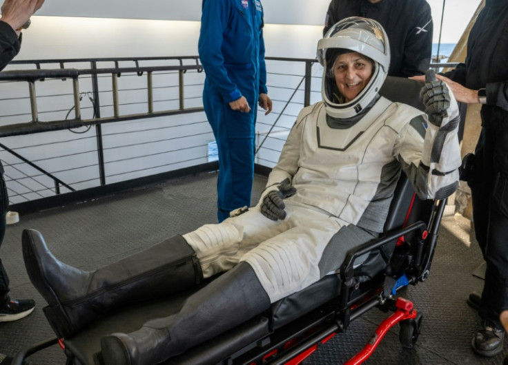 This photo provided by NASA shows NASA astronaut Suni Williams being helped out of a SpaceX Dragon spacecraft on board the SpaceX recovery ship MEGAN