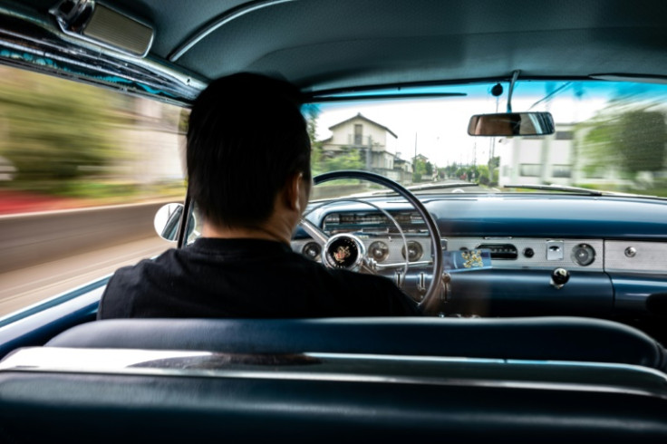 Yosuke Fukuda, the owner of US car dealer Y-Tech, sits in a 1954 Buick Roadmaster in Fukaya of Saitama Prefecture