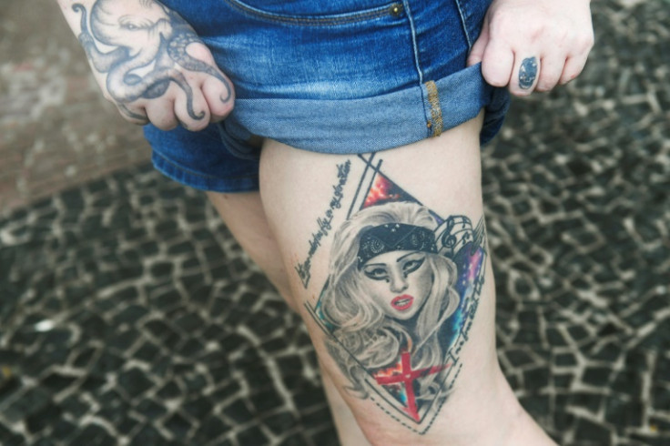 A fan shows a tattoo of US singer Lady Gaga at Rio's Copacabana Beach, where the pop star will stage a free concert
