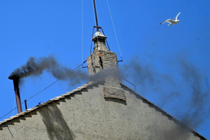 Black smoke rose from the chimney of the Sistine Chapel signalling that cardinals failed to elect a new pope