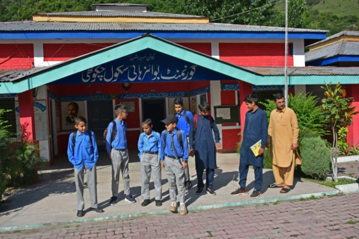 Students returning to school in the frontier village of Chakothi near the Line of Control in Pakistan-administered Kashmir